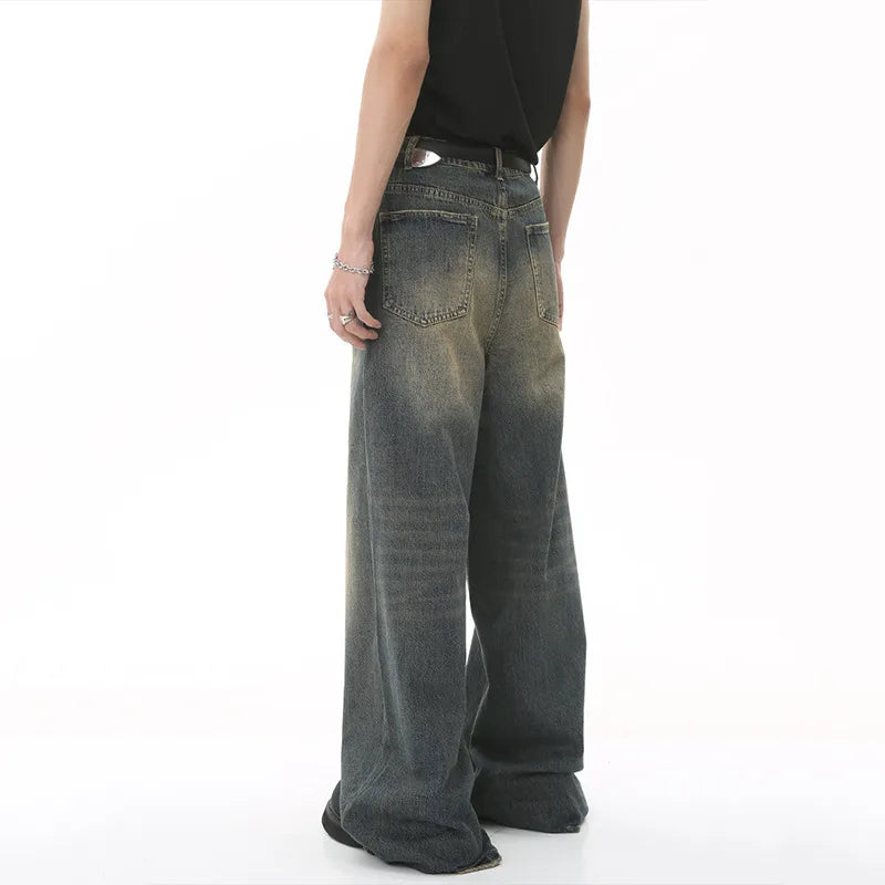 old blue washed denim pants, featuring a wide leg design and casual look, viewed from the back
