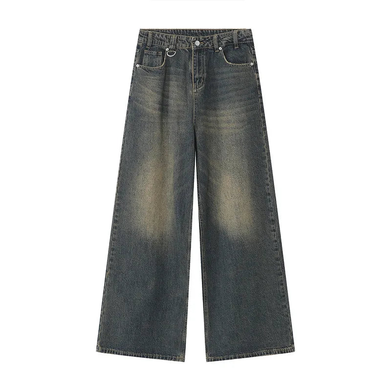 old blue washed denim pants featuring a loose, wide-leg design and vintage wash.