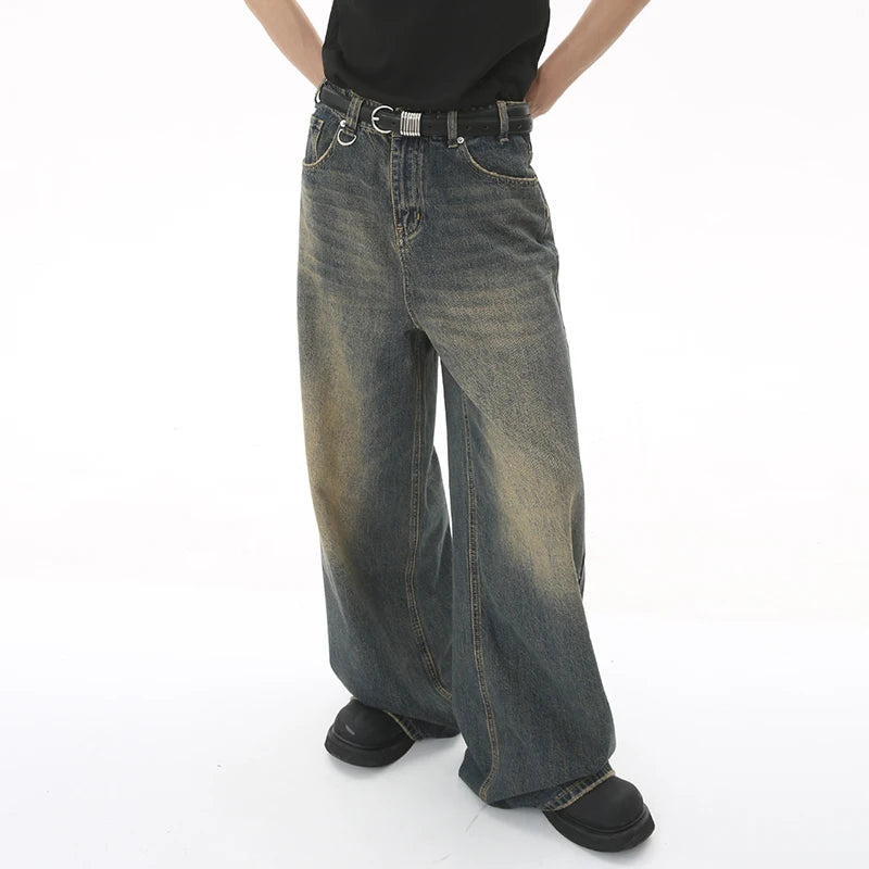old blue washed denim pants featuring a relaxed fit and vintage style, perfect for casual outfits.