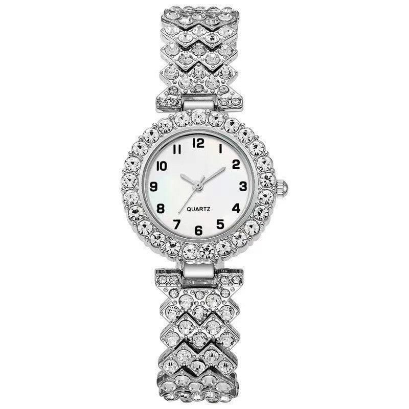 Silver quartz wristwatch with sparkling rhinestone accents and stylish bracelet design for women.