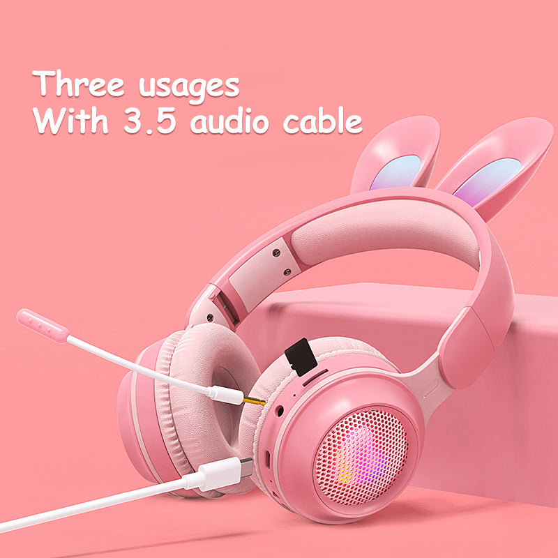 Wireless rabbit ear headphones in pink with 3.5 audio cable and three usage options, ideal for music and calls.