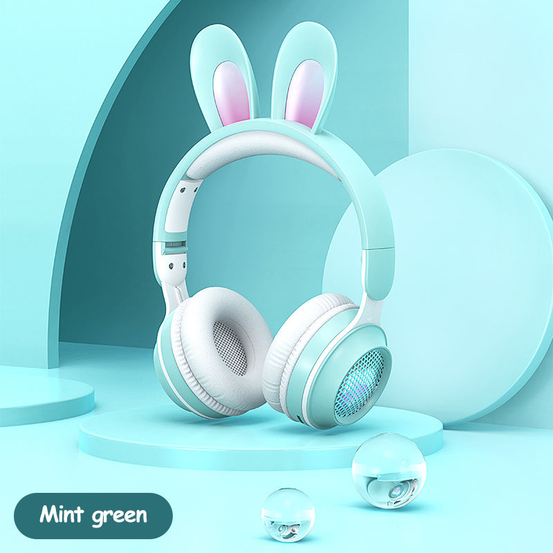 Mint green rabbit ear headphones with a playful design, perfect for wireless music and calls. Stylish and fun accessory.