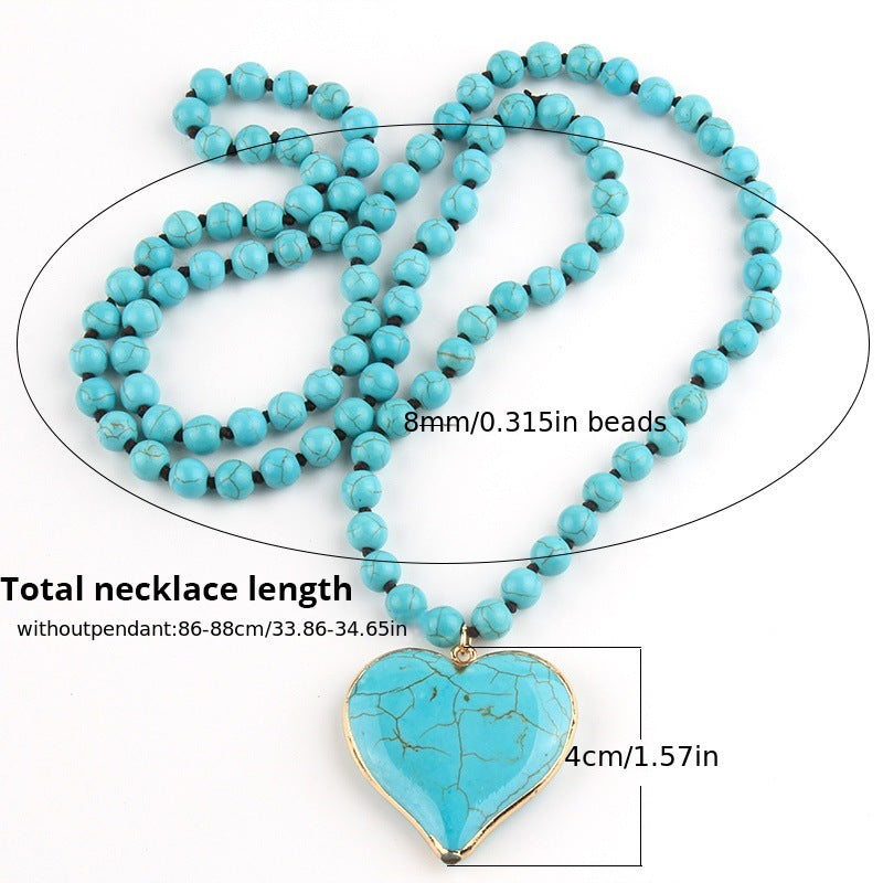 Vintage handmade knotted turquoise beaded necklace with heart-shaped mother pearl pendant, unisex bohemian style.