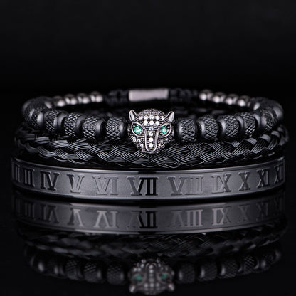 Black animal-themed bracelet set featuring a wolf head with emerald accents and intricate woven details.