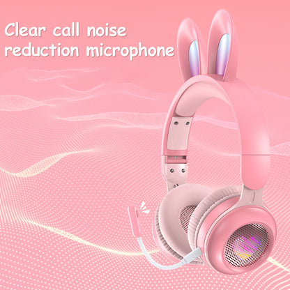 Wireless pink rabbit ear headphones with clear call noise reduction microphone and soft ear cushions.